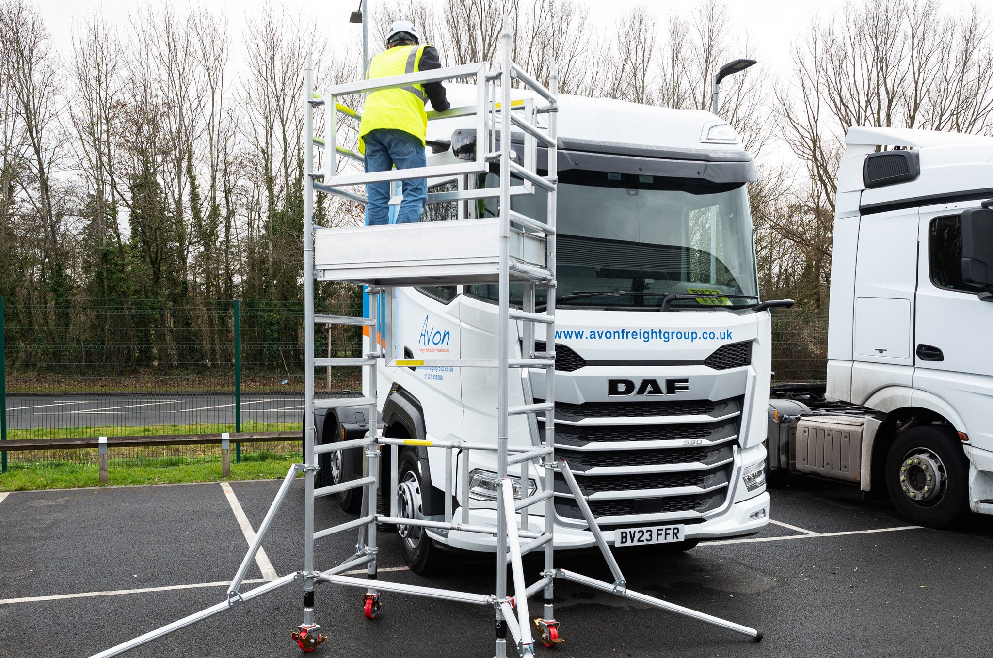 A photo of the Alto Mini Tower against a HGV