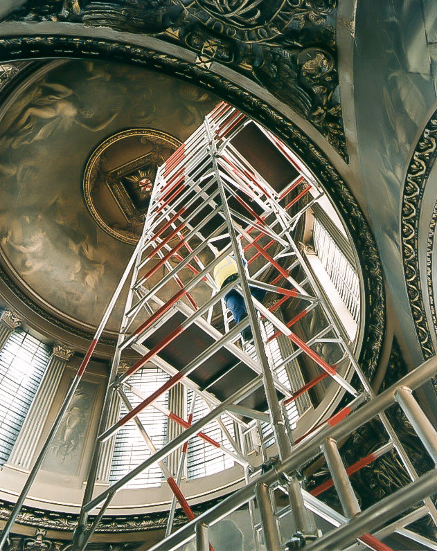 Alto aluminium access tower with elevated platform and cantilever arrangement inside the historic Painted Hall, Old Royal Naval College, Greenwich.