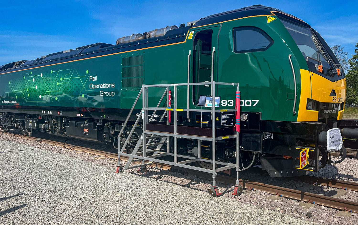 Rail Operation Group locomotive alongside an Alto Access access solution, demonstrating safe access for rail maintenance.