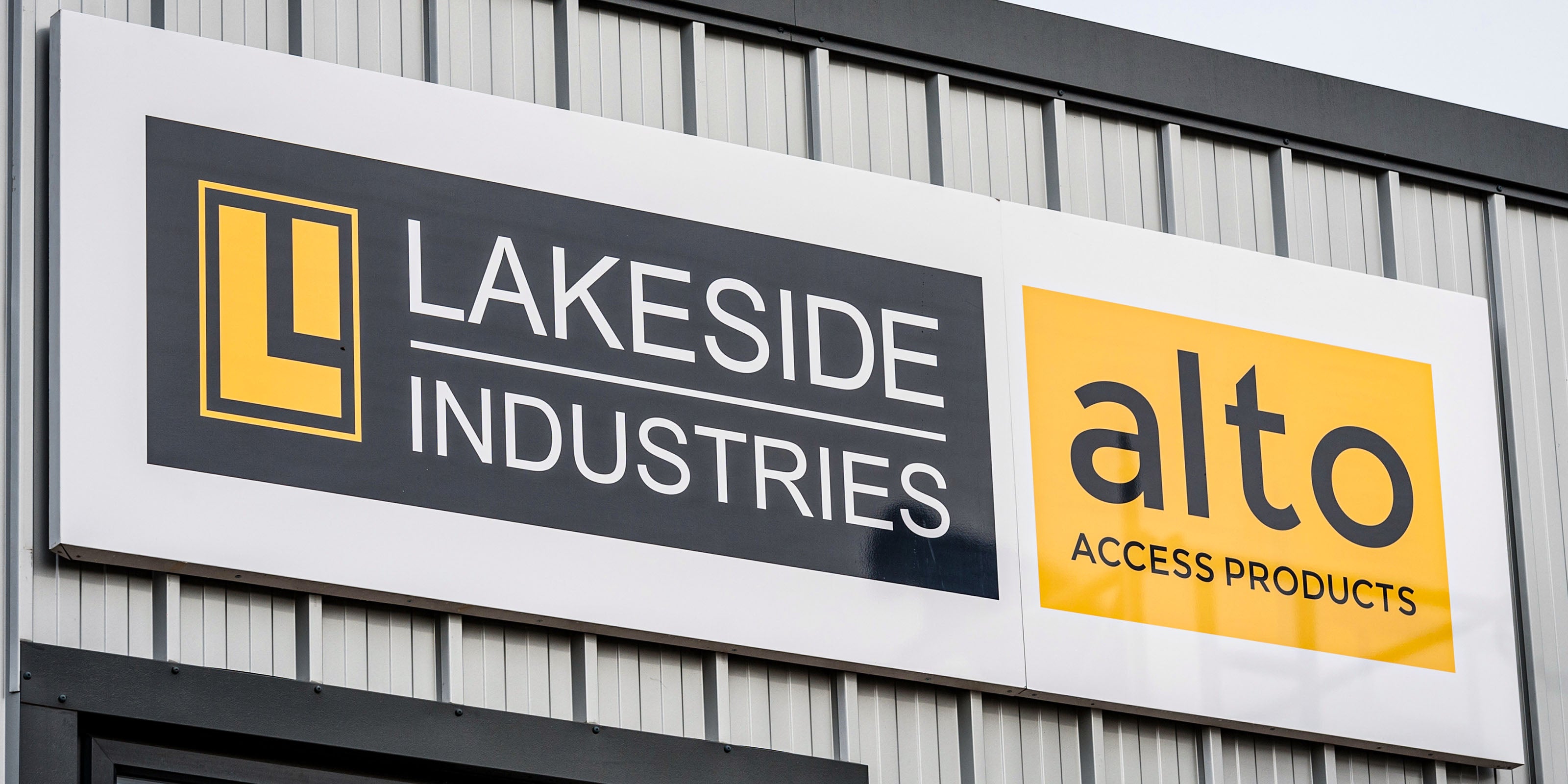 A building with the Alto and Lakeside Industries logos on it.