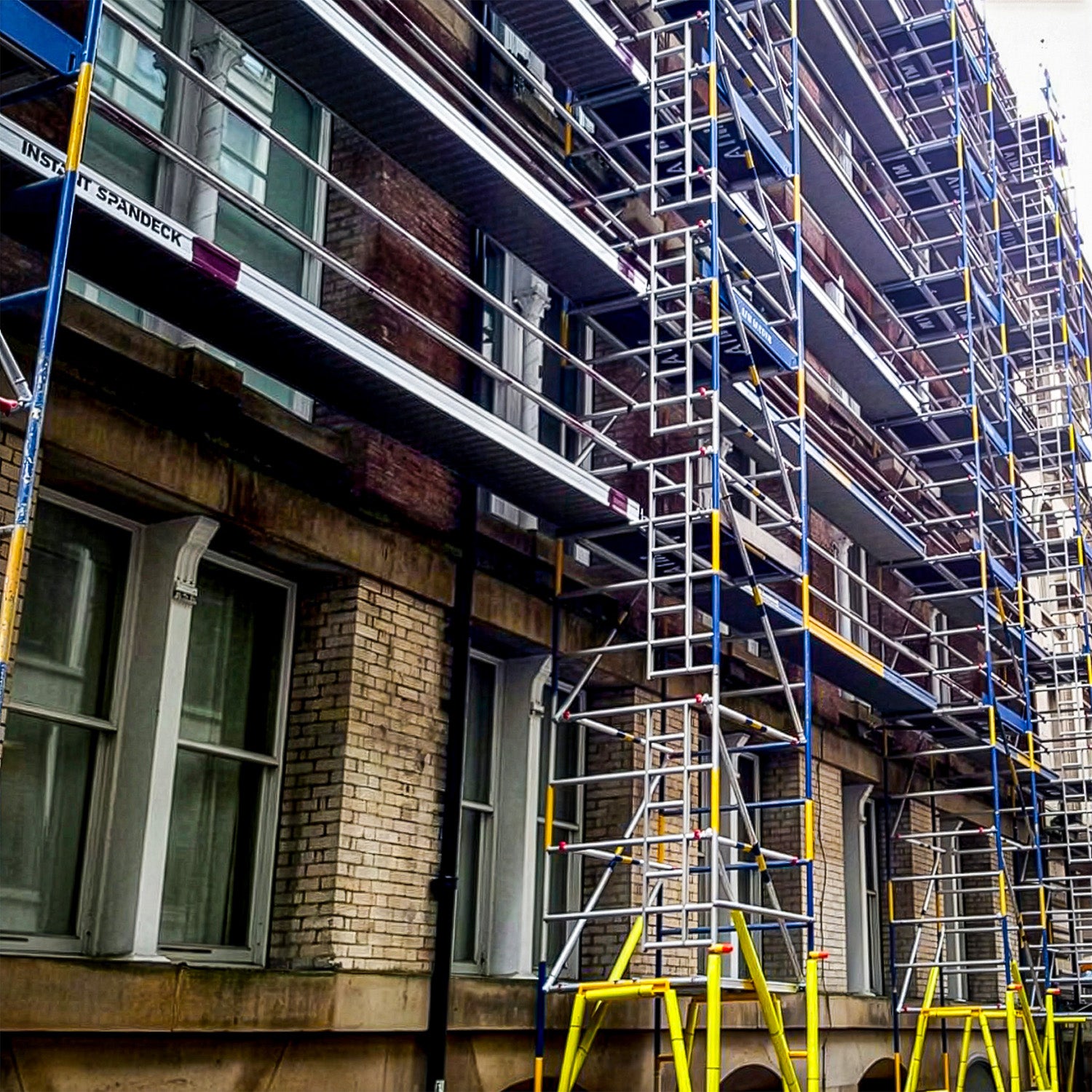 Alto HD Linked Towers against a building.