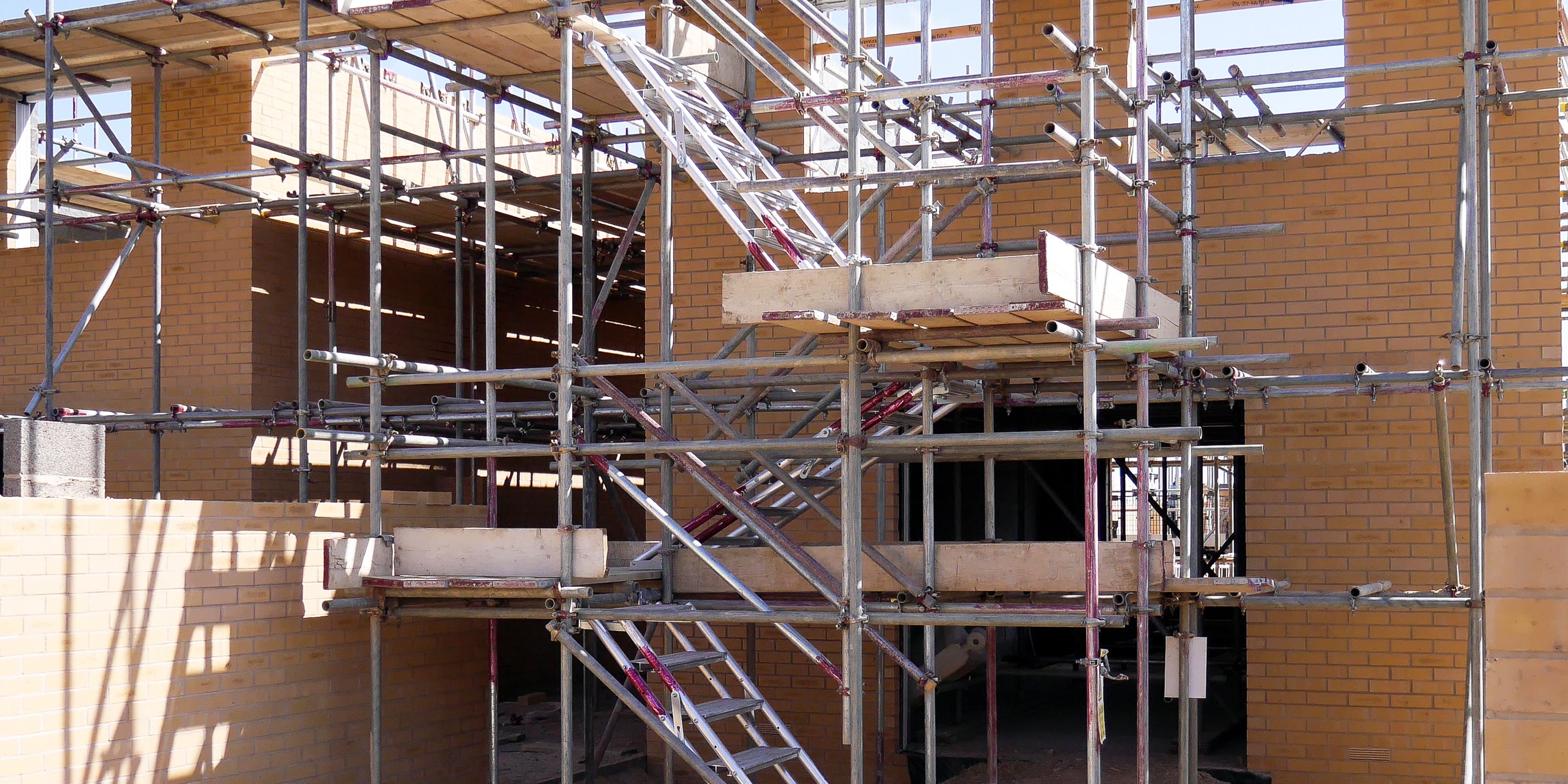 New home under construction with Alto Universal Stairs used for access.