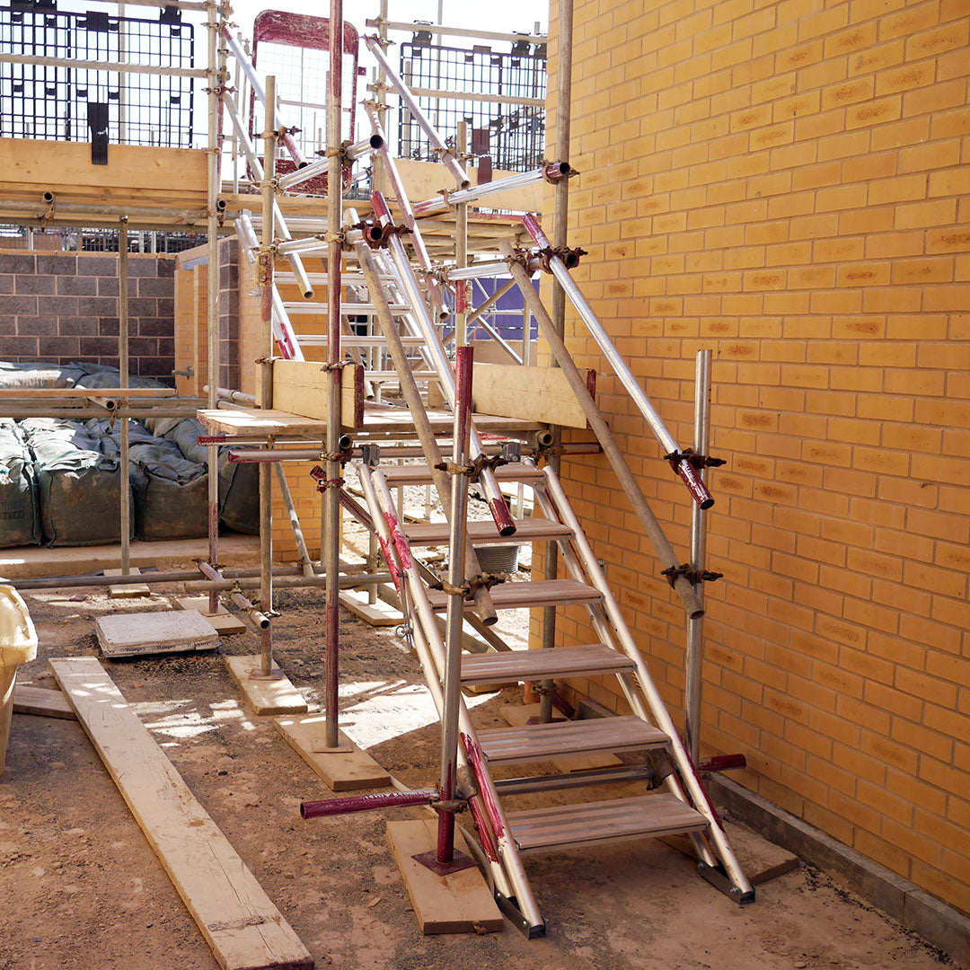 Two Alto Universal Stairs used to create a staircase on a building site.