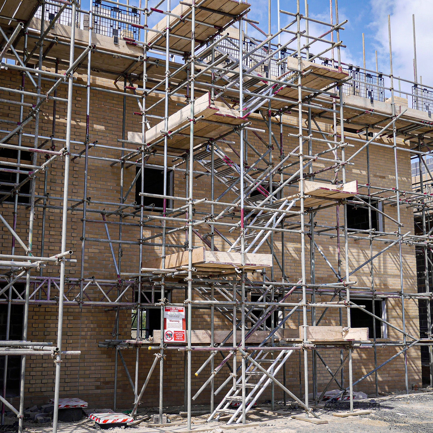 A scaffold stair tower using Alto Universal Stairs constructed on a building site.