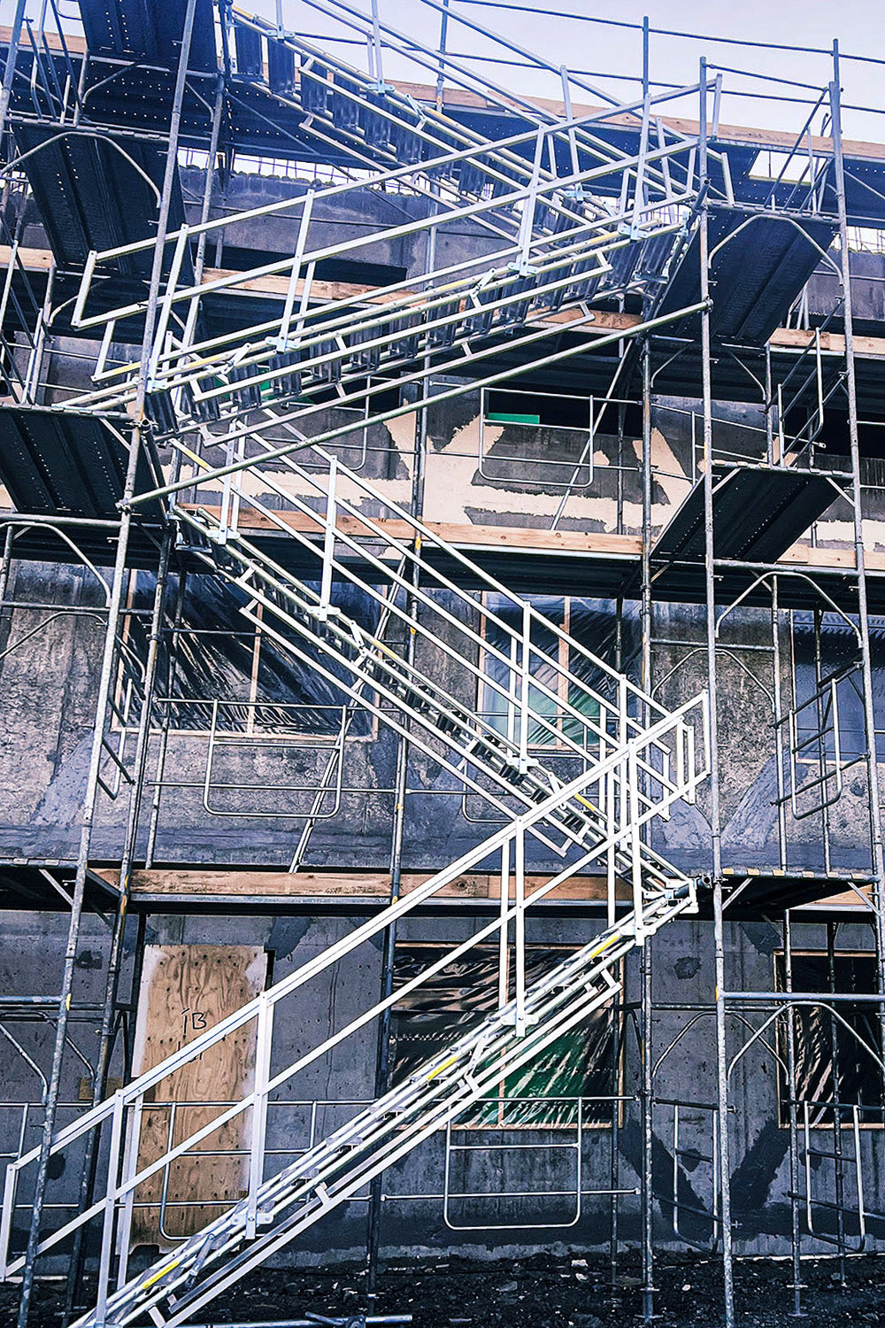 A scaffold stair tower using Alto Universal Stairs constructed on a building site.